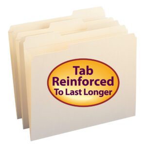 A set of Smead File Folders (10334) is slightly fanned out, displaying their durability. The front folder has a large yellow oval sticker with bold red text: Tab Reinforced To Last Longer. This Manila letter-size set includes 100 folders per box, featuring reinforced 1/3-cut tabs.