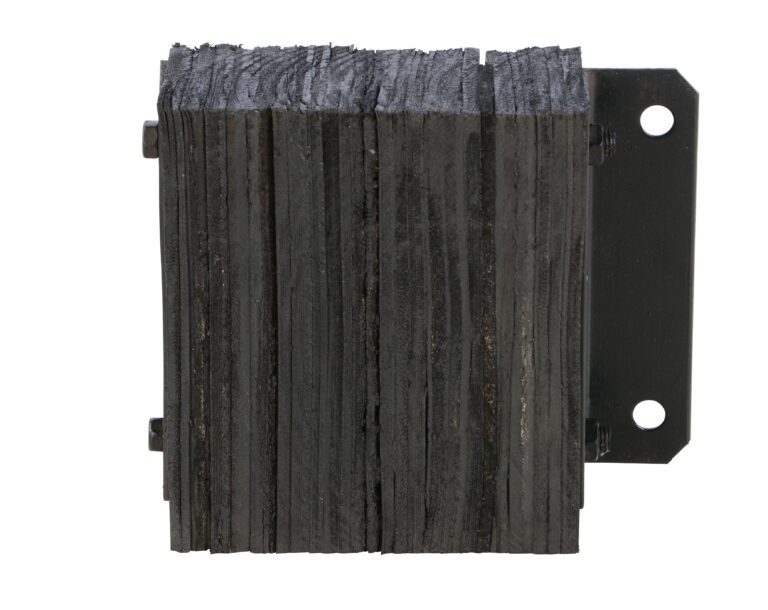 A black, rectangular wooden fence post with parallel grooves is mounted on a sturdy metal bracket similar to the reliable Vestil Laminated Dock Bumper 12 X 14 X 4.5In. The bracket has two visible holes for fastening, and the post appears textured and weathered.