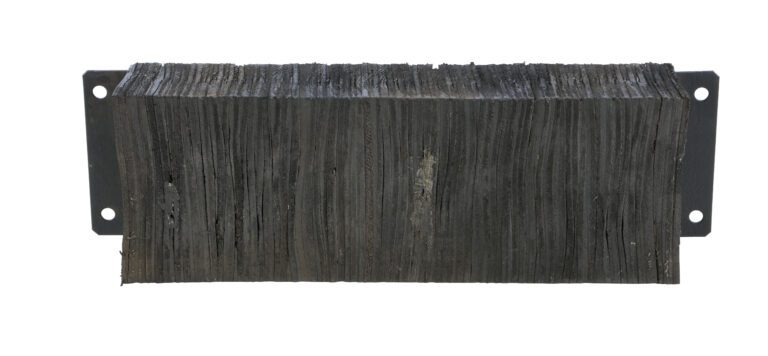 The Vestil Laminated Dock Bumper 12 x 36 x 6 In is a rectangular, dark, layered block with a textured surface, mounted on a flat metal bracket featuring attachment holes on each side.