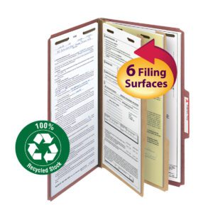 The Smead 100% Recycled Pressboard File Folder (19023) is open, revealing multiple sections with documents. It boasts two dividers for organization, a circular arrow graphic for 6 Filing Surfaces, and a green recycling symbol for 100% Recycled Stock.