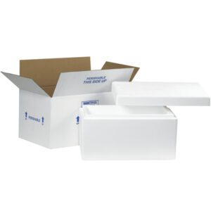 A white Styrofoam cooler with a detached lid fits perfectly inside an MH-USA 17 x 10 x 8 1/4 Insulated Shipping Kit, featuring a cardboard box labeled with blue text stating PERISHABLE - THIS SIDE UP, along with arrows for proper orientation.
