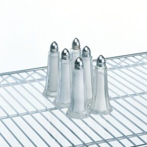 Six clear glass salt shakers with silver tops sit neatly on a wire shelving unit. The plain white background accentuates the simple and organized display of the shakers.