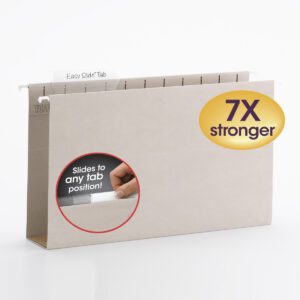 The Smead TUFF Hanging Box Bottom Folder in Steel Gray features a 1/3-Cut Sliding Tab for easy labeling. A circular inset shows a hand adjusting the tab, and a purple and yellow badge reads 7X stronger. This legal-size folder ensures organization and durability, making it perfect for your needs.