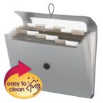 The Smead Step Index Poly Organizer in silver (70903) has 12 labeled pockets for sorting, a flap and cord closure for security, and an easy-clean design with an arrow graphic featuring a hand and sparkles. It accommodates letter-size papers.