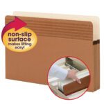 Smead Easy Grip? File Pockets, with a straight-cut tab and non-slip surface label, accommodate legal-size documents and offer a 1-3/4 expansion. A highlighted circle shows a hand lifting one from a filing cabinet drawer. Available in boxes of 25 per Box (73213).