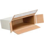 An MH-USA 9 1/4 x 3 x 6 3/4 Self-Seal Side Loading Box is open on its side with flaps extended, revealing a brown corrugated interior. Its unfolded shape highlights the rectangular design and pristine white exterior.