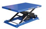 The Vestil Heavy Duty Air Bag Scissor Table 1K Lb, designed for industrial use, is a blue hydraulic lift with a flat platform, sturdy metal frame, and black height-adjusting mechanism on a blue base.