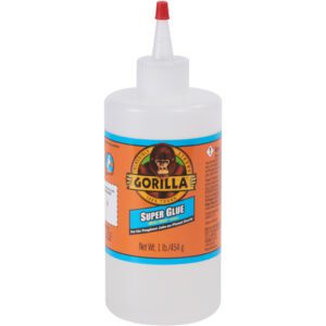 The 16 oz. Gorilla® Super Glue bottle, featuring the iconic orange label and Gorilla logo, includes a red-tipped nozzle for precise application. Weighing 1 lb (454 g), it is ideal for tough jobs.