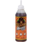 The 18 oz. Gorilla Glue® bottle features a pointed nozzle and the iconic gorilla image on its vibrant orange and brown label, highlighting Original Gorilla Glue. It is renowned for its strong bonding properties on wood, stone, metal, ceramic, foam, and glass.