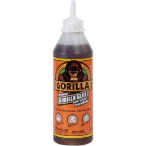 The 18 oz. Gorilla Glue® bottle features a pointed nozzle and the iconic gorilla image on its vibrant orange and brown label, highlighting Original Gorilla Glue. It is renowned for its strong bonding properties on wood, stone, metal, ceramic, foam, and glass.