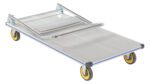 The Vestil Aluminum Platform Truck 0.6K 24 X 48 has a gray flatbed, yellow wheels, and a robust metal handle in its folded form against a white background, showcasing its versatility.