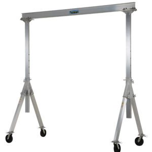 The Vestil Adjust Aluminum Gantry Crane 2K 15 X 10 is a portable crane with adjustable height, four caster wheels, a labeled straight top beam, and stable angled legs.