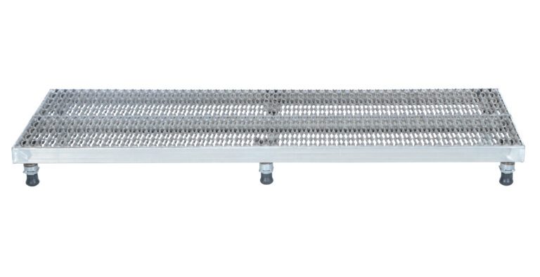 The Vestil Adj Ss Work Stand 6.75-8.75 H 23.5 X 72 has a robust metal grate step platform with grid pattern and four support legs, making it perfect for construction sites by providing drainage and grip for safe standing or walking on its flat surface.