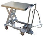The Vestil Air Ss Cart 1000 Lb features a stainless steel hydraulic lift table with a 19.6875 x 32.5 top, four wheels, and a manual hydraulic system with a foot pedal for elevation, plus a black coiled hose on the side.