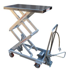The Vestil Air SS Cart 800 lb features a silver scissor lift mechanism with caster wheels and a handle. It includes a flat, rectangular top measuring 20 x 35.5 inches and a hydraulic hose at the base for smooth lifting operations.
