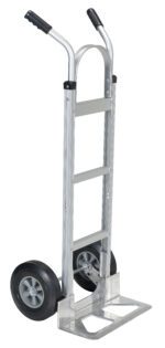 The Vestil Aluminum Hand Truck W/Hard Rubber Wheels features a sleek silver frame, robust hard rubber wheels, and sturdy black handles, making it ideal for handling heavy loads with ease.