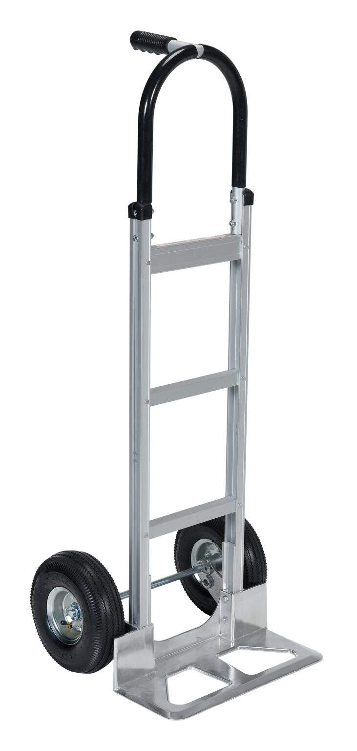 The Vestil Alum Pin Handle Hand Truck Pneumatic has a silver frame with a black handle, two large pneumatic rubber wheels, and a flat base platform perfect for carrying items. Its metal frame with riveted joints ensures durability.