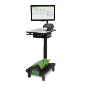 Mobile workstation with a mounted monitor displaying software, a keyboard, and a printer. A green power module is attached at the bottom, and the unit is on wheels for easy mobility.