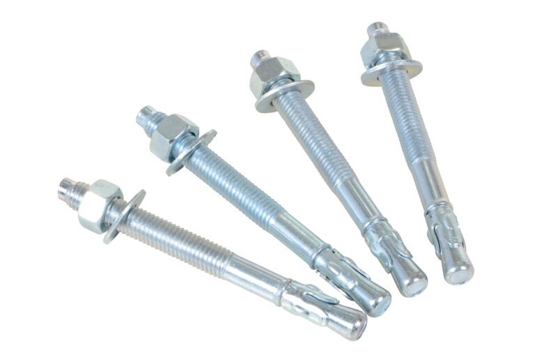 On a white background, the Vestil 4-Pack Concrete Anchor Bolts 1/2 X 5 In gleam in silver and reflective tones. The bolts are arranged neatly, each with a threaded rod, nut, washer, and expanding end for secure installation into materials.