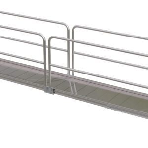 The Vestil Alum Walk Ramp Handrail Overlap 192 X 28In features an aluminum wheelchair ramp with side handrails, a slight incline, and non-slip surface for accessibility, highlighted by a white background that accentuates its metallic construction and straightforward design.