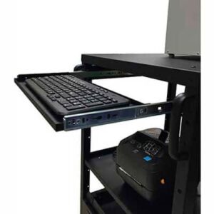 A black metal rack with a sliding tray holds a keyboard. Below the tray, a label printer is placed on a shelf. The rack appears to be part of a workstation setup.