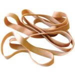 A loose arrangement of MH-USA 5/8 x 8 Rubber Bands (10 Lbs/Case) in beige lies on a plain white background, with the thin bands slightly varying in size to form an overlapping pattern.
