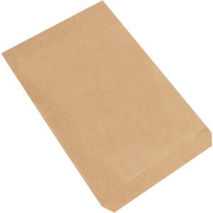 A 7 1/2 x 10 1/2 Kraft Flat Merchandise Bag from a pack of 2000 cases rests effortlessly on the white surface, exuding simple elegance and practicality.