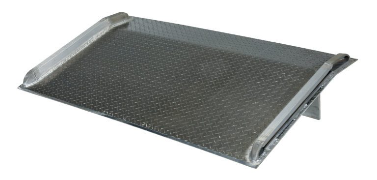 The Vestil Aluminum Truck Dockboard 5000 Lbs 84X54 features a diamond plate pattern and slightly raised edges for safety and stability, allowing a smooth transition over curbs or small obstacles.
