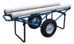 The Vestil Rug Dispenser, a blue metal cart with foam-filled wheels and foldable black legs, easily holds three long white PVC pipes. Measuring 25.94 x 61, it features a sturdy handle for smooth maneuverability across various surfaces.