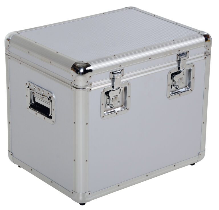 The Vestil Medium Aluminum Case 16.15X21.5X19.15 is a robust, industrial storage box with a light grey body, shiny metal edges, two front clasps, and a side handle, all bounding its rectangular form with the lid closed.