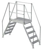 The Vestil Galvanized Cross-Over Ladder 103.5X92.15In 5 Step features a gray metal design with handrails and anti-slip steps for safe navigation, offering five steps on each side that lead to a central platform, ideal for easy crossing over obstacles in industrial settings.