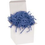 The white open box is filled with MH-USA 10 lb. Navy Blue Crinkle Paper, forming a cushion of blue paper shreds for packing.