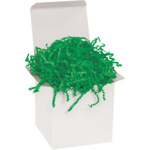 A plain white gift box overflows with vibrant MH-USA 10 lb. Green Crinkle Paper, its cheerful color spilling over the edges and contrasting with the simple box, suggesting its decorative intent.