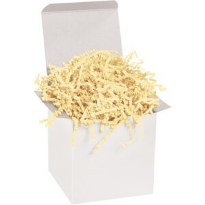 An open white gift box filled with MH-USA 10 lb. French Vanilla Crinkle Paper (10 Lbs/Case) creates a charming display as soft, light yellow shreds spill gently over the edges, while the plain backdrop accentuates their subtle elegance.