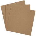 Three overlapping MH-USA 8 x 8 Chipboard Pads are fanned out, showcasing their sturdy texture. Each square-shaped pad resembles the grainy feel of sandpaper and is set against a plain white background.