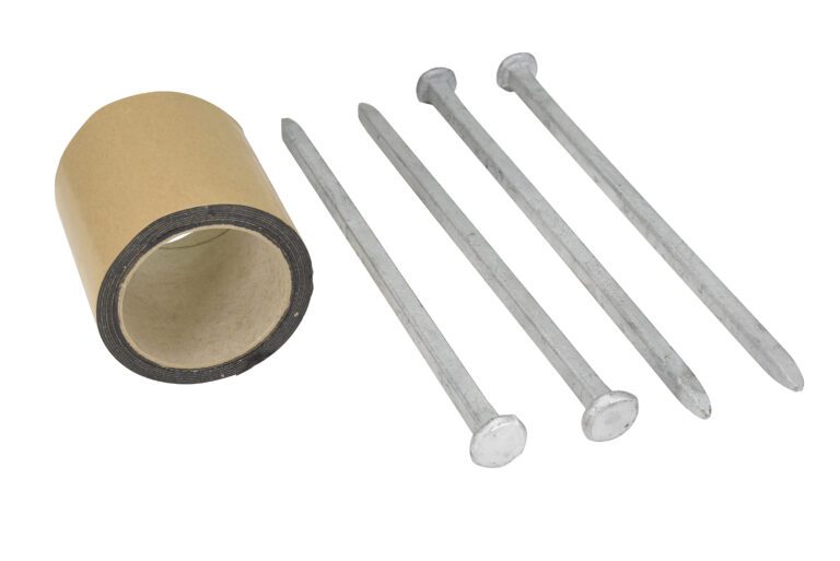A roll of brown tape lies next to four large metal nails, resembling those in a Vestil Anchor Kit for a 4-Hole Car Stop, all arranged on a pristine white background.