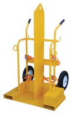 The Vestil Fire Proof Welding Torch Cart 500 Lb is a yellow industrial hand truck with a tall vertical backrest. It includes two black handles, large rubber wheels, secure cargo straps, and a wide base for stability, designed for heavy-duty transport up to 500 lbs.