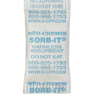 A white silica gel packet from MH-USA 5/8 x 1 9/32 Silica Gel Packets (6000/Case) is labeled SÜD-CHEMIE SORB-IT with Harmless Adsorbent, Do Not Eat in blue text, and includes two phone numbers and a website URL.