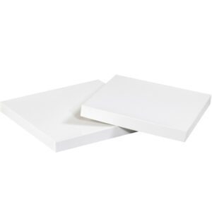 Two plain white square panels, resembling the MH-USA 19 x 12 White Deluxe Gift Box Lids (50/Case), are elegantly angled against a spotless white backdrop.