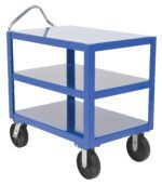 The Vestil Heavy Duty Ergo Handle Cart 3Shelf 34X60 is a blue metal utility cart with three shelves and four large black wheels. It features a chrome handle for easy maneuvering and is shown empty against a white background.