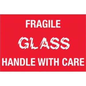 A red sign with white text states FRAGILE GLASS HANDLE WITH CARE, similar to MH-USAs 2 x 3 Fragile - Glass - Handle With Care labels, available in rolls of 500 for your packaging needs.