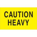 The MH-USA 3 x 5 Caution - Heavy fluorescent yellow labels feature bold black text, come in rolls of 500, and are ideal for ensuring high visibility for safety needs.