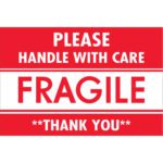 A sign with bold letters reads PLEASE HANDLE WITH CARE FRAGILE THANK YOU, similar to MH-USAs 2 x 3 Fragile - Handle With Care labels, available in a roll of 500.