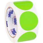 A roll of white tape includes large fluorescent green stickers, with a cardboard core featuring tape logic branding. Packaged as MH-USA 2 Fluorescent Green Inventory Circle Labels (500/Roll).