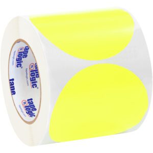 A roll of MH-USA 4 Fluorescent Yellow Inventory Circle Labels (500/Roll) with a white backing features tape logic on the inner core, offering bright, vivid stickers ideal for attracting attention in any setting.