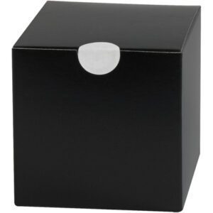 A simple black cube-shaped box with a circular white tab at the top center, much like MH-USA 1 White Perforated Circle Paper Mailing Labels. The box has a smooth, matte finish and appears to be made of cardboard or a similar material.