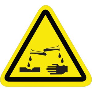The MH-USA 2.25 triangular safety label features a yellow warning sign with a black border, depicting test tubes spilling liquid onto a surface and hand to illustrate the hazard of corrosive substances, effectively communicating potential risks.