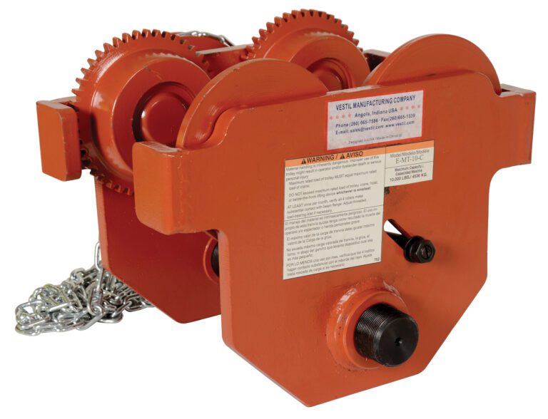 The Vestil Eye Manual Trolley Geared 10K Capacity showcases an orange industrial hoist with visible gears, chain, and a manufacturers label. It offers sturdy construction and a prominent warning label for safe heavy lifting.