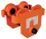 The Vestil Eye Manual Trolley Push, with an 8K capacity, is an orange industrial trolley designed for beam or track lifting. It has four wheels, metal components, and warning labels on the side.