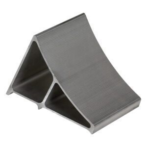 The Vestil Aluminum Wheel Chock 7 x 11.75 x 8 inches is a metal wedge with a grooved surface and triangular shape, designed to secure vehicles.